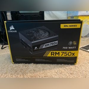 Black CORSAIR RM750x High performance power supply for PC.